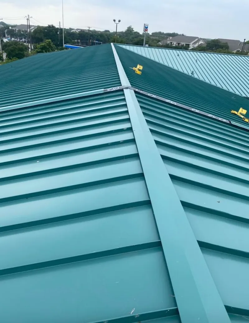 Green commercial metal roof ridge and valley for Metal Roof Repair in Breaux Bridge