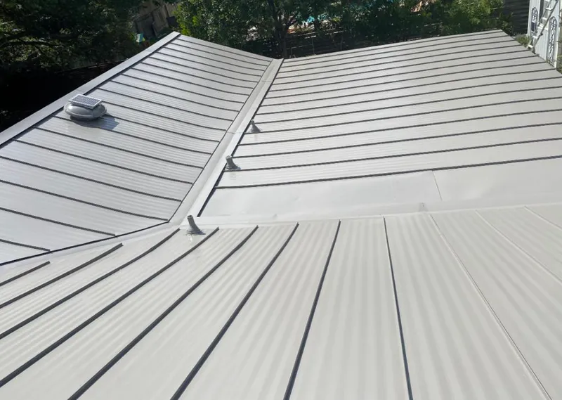 Solar attic fan installed on a metal roof for Roof Ventilation in Breaux Bridge